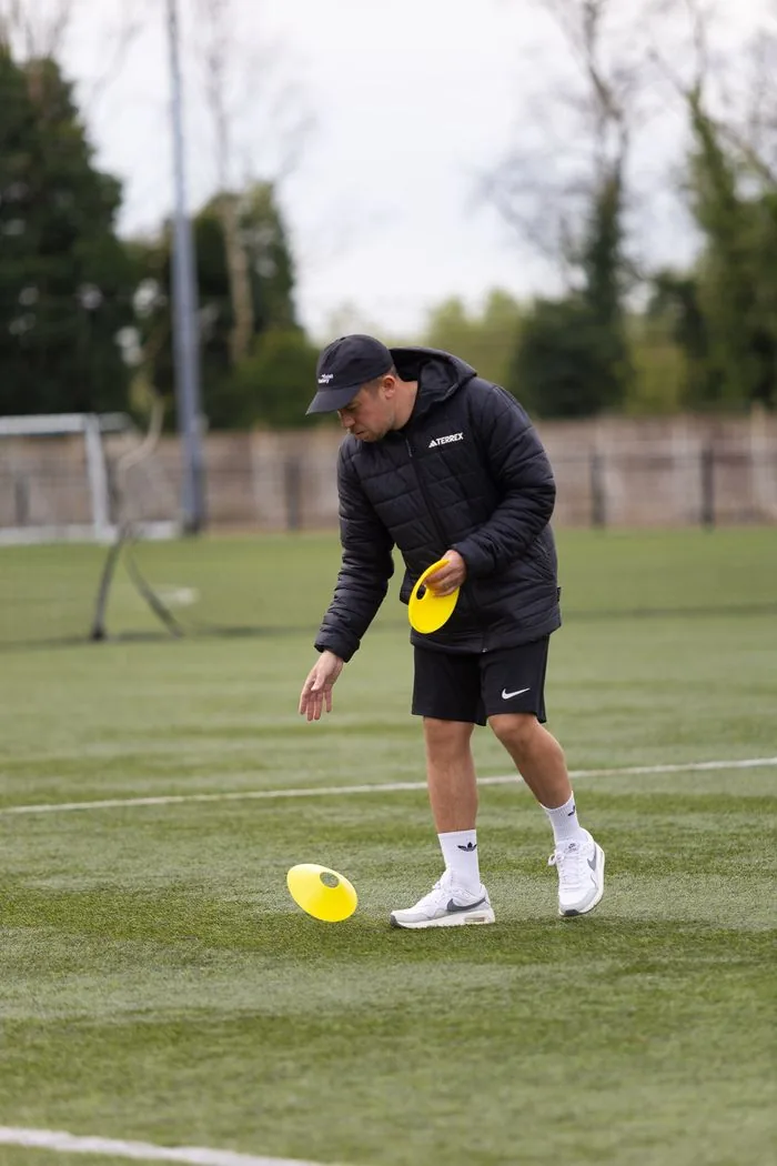 EPP FA-approved coach setting up training session on pitch Birmingham