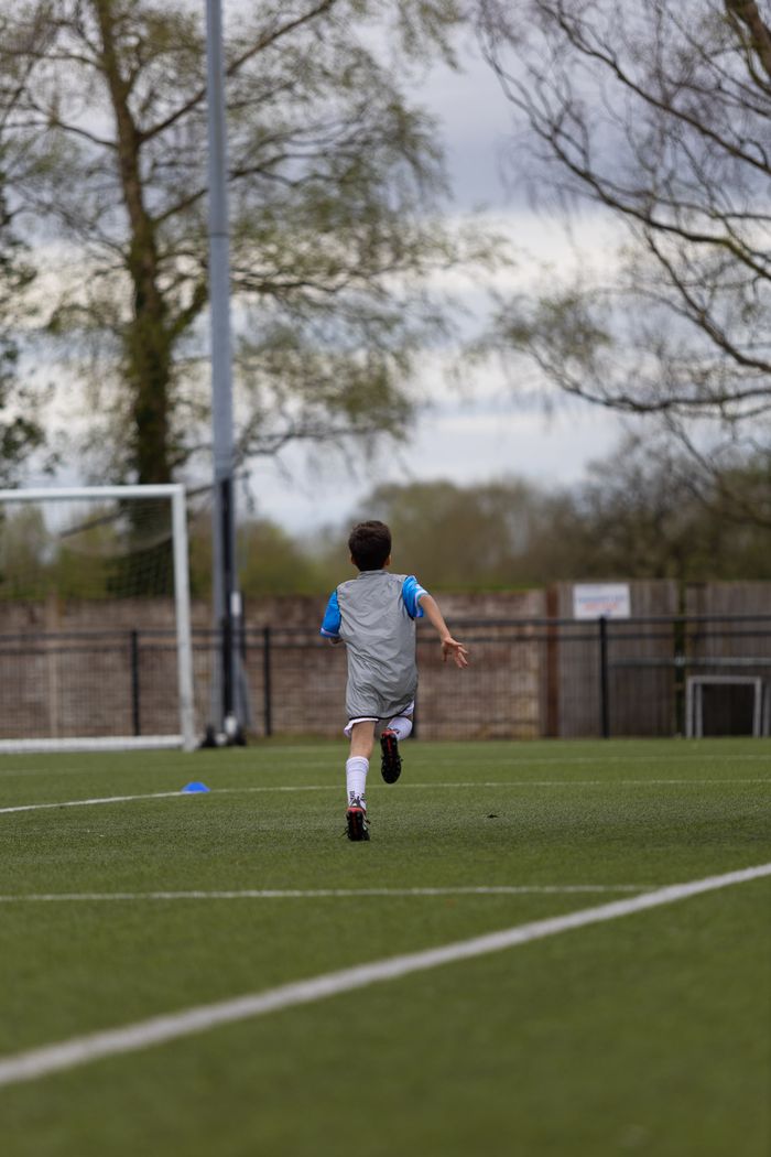 Young athlete sprinting across pitch at EPP SAQ class Birmingham