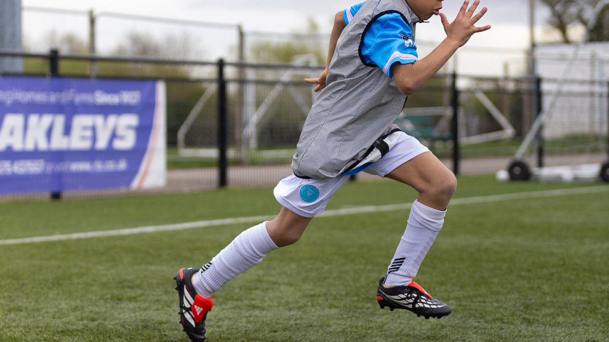 Youth athlete sprinting at full speed during EPP speed and agility class Birmingham